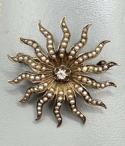 Antique 10K gold starburst brooch with seed pearls and diamond center