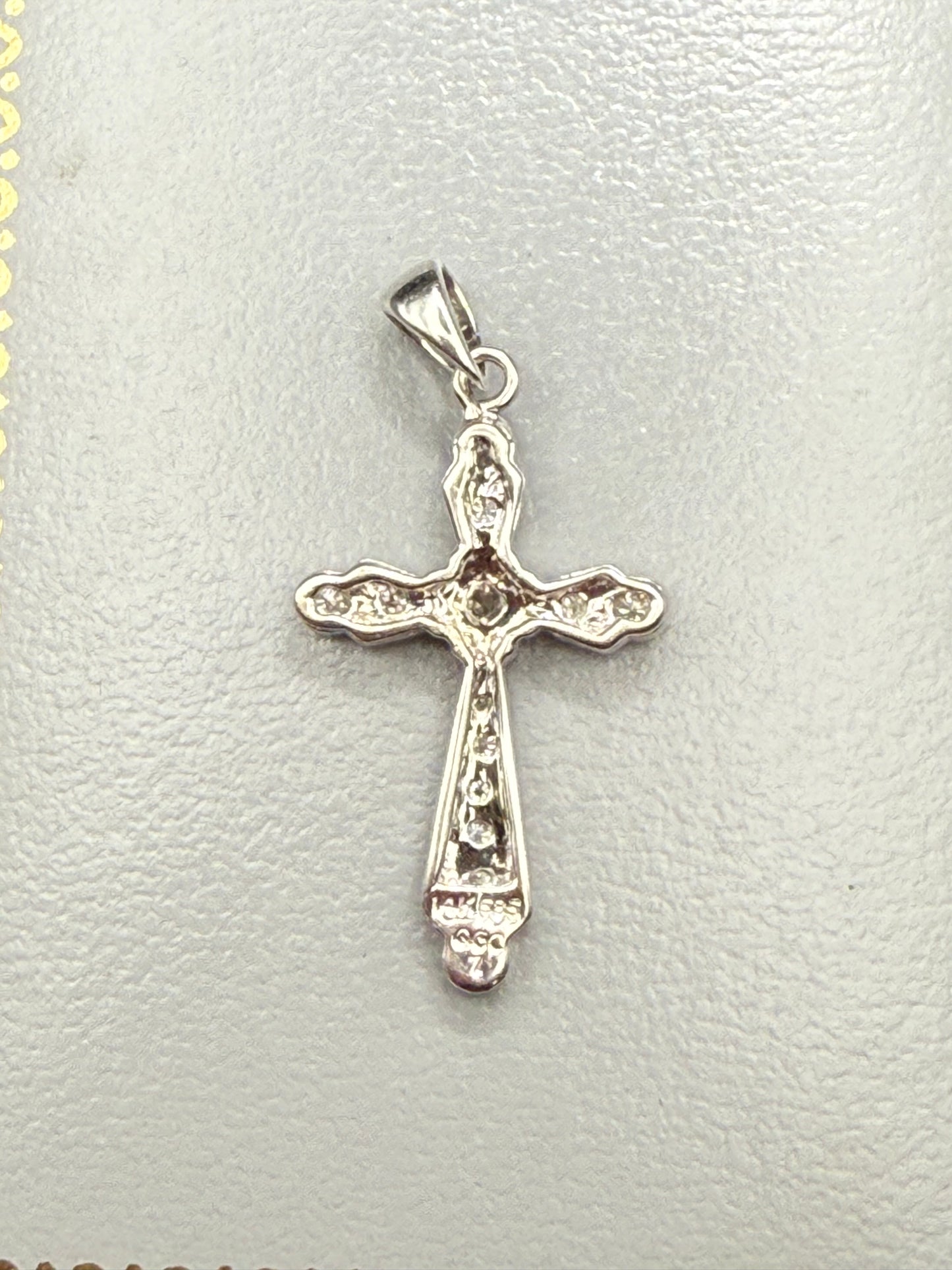 Back view of 14K white gold diamond cross pendant showing 14K 585 stamp