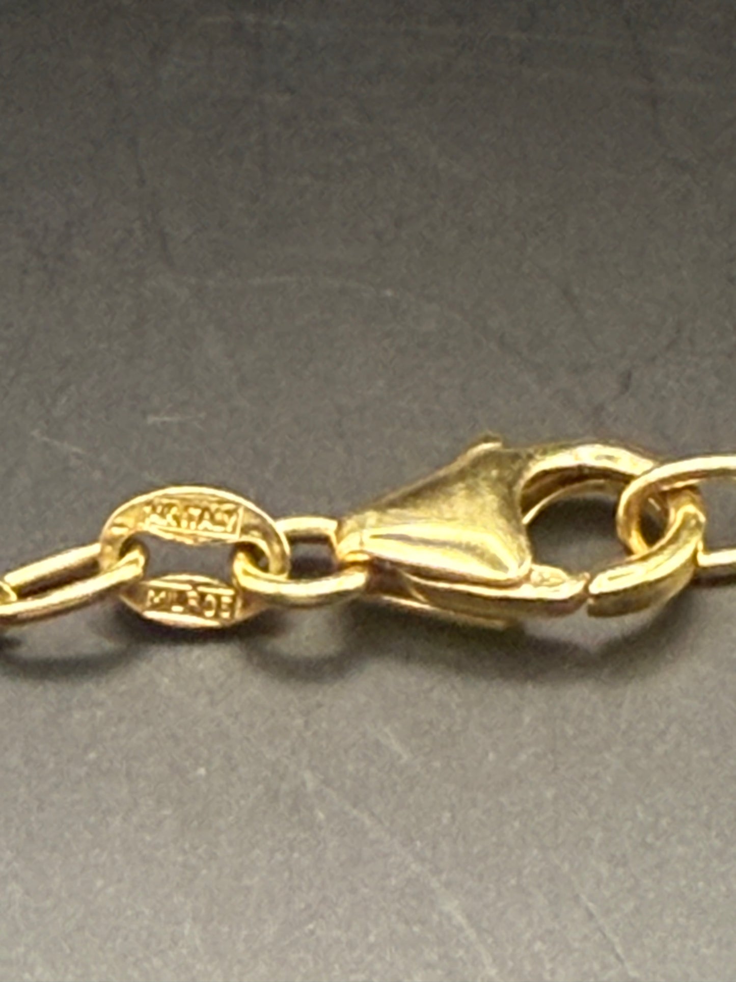 Clasp detail showing 14K stamp and “Miltos” maker’s mark