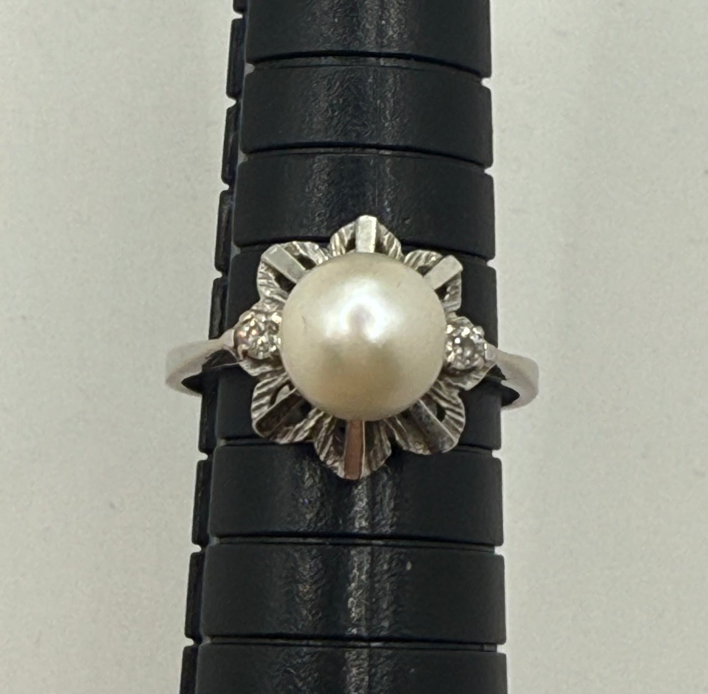 Pearl and diamond vintage ring measured on mandrel, showing size 9.