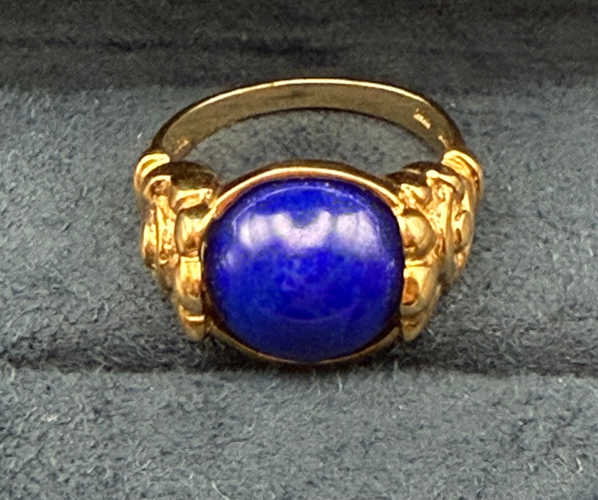 Antique 10K gold ring with rich blue lapis lazuli cabochon, front view.