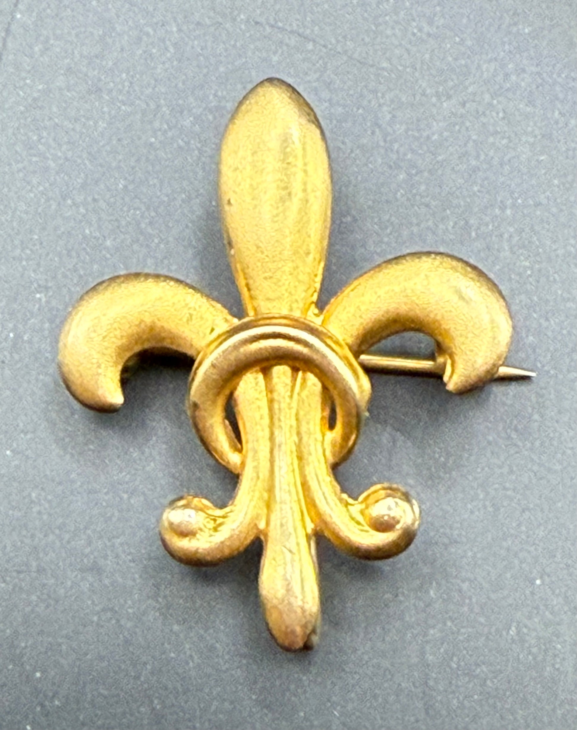 Antique 10K yellow gold French Fleur-de-Lis brooch with high-polish finish, front view