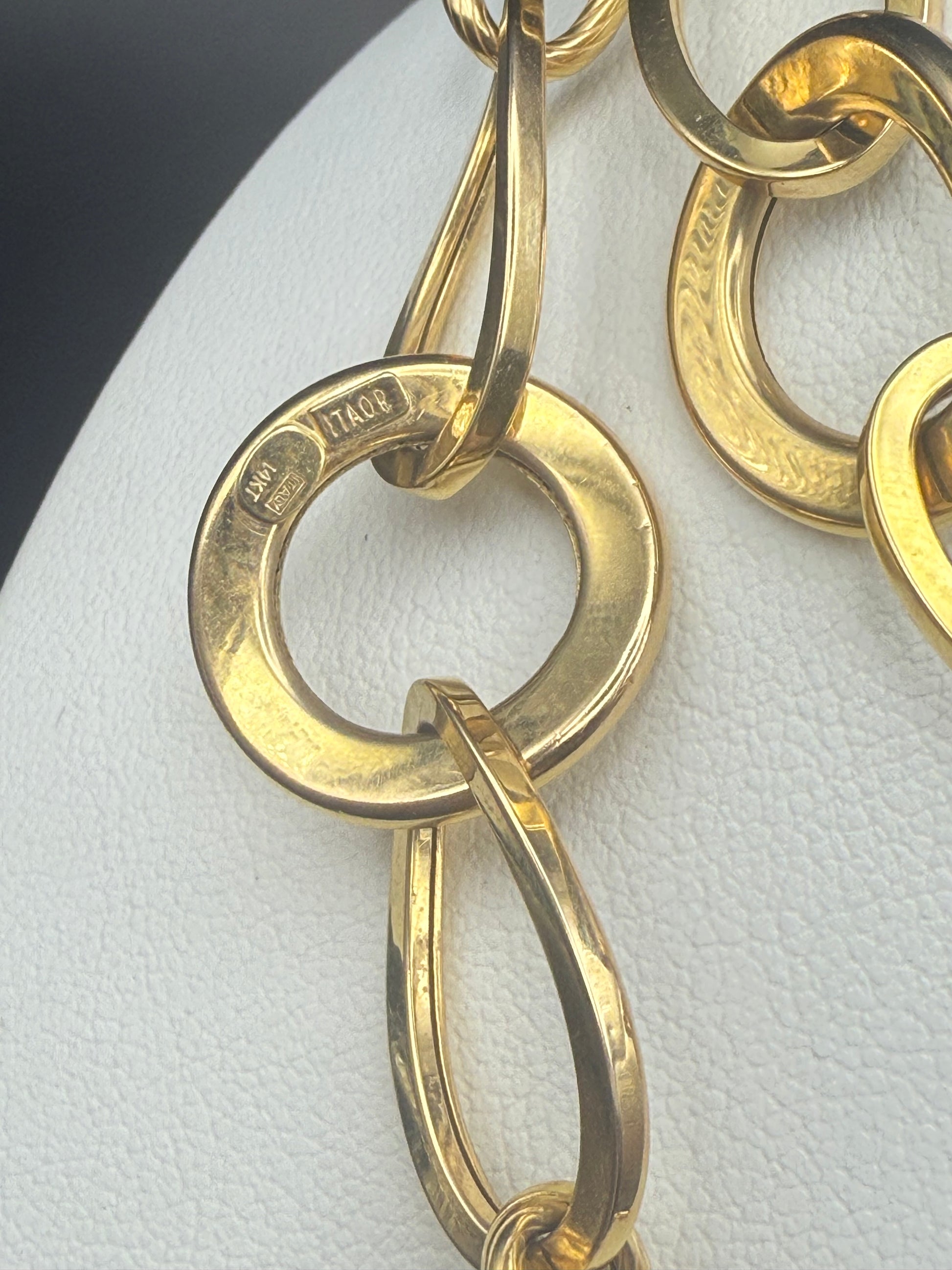 Close-up of 14K gold Italian hallmarks on necklace link