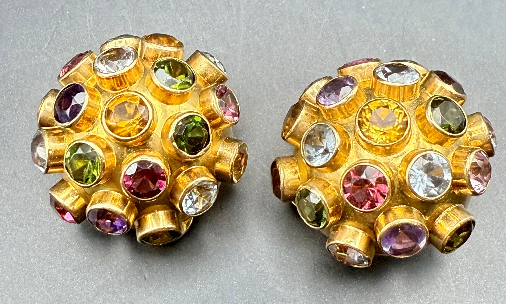 Close-up of colorful gemstones set in domed gold structure