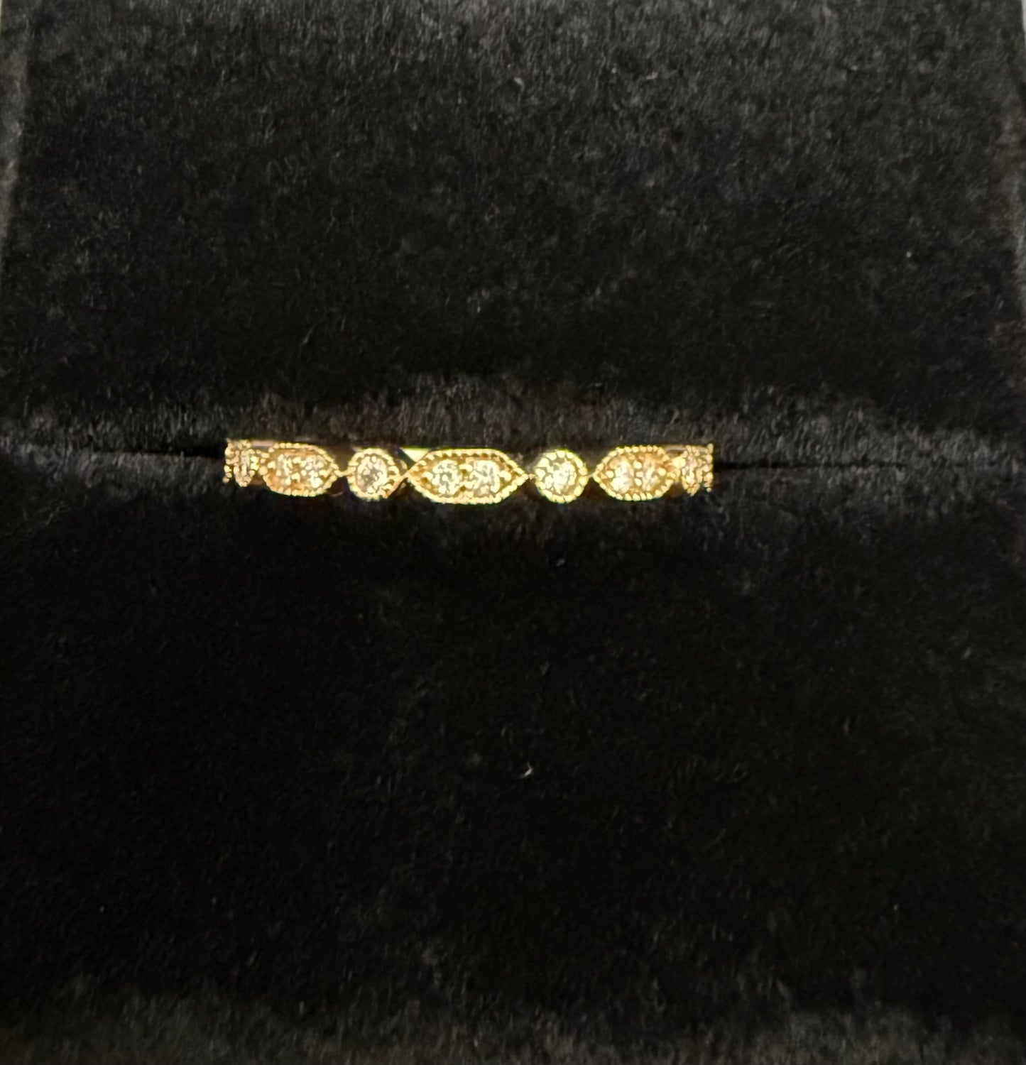 Close-up of diamond details in oval and round alternating settings