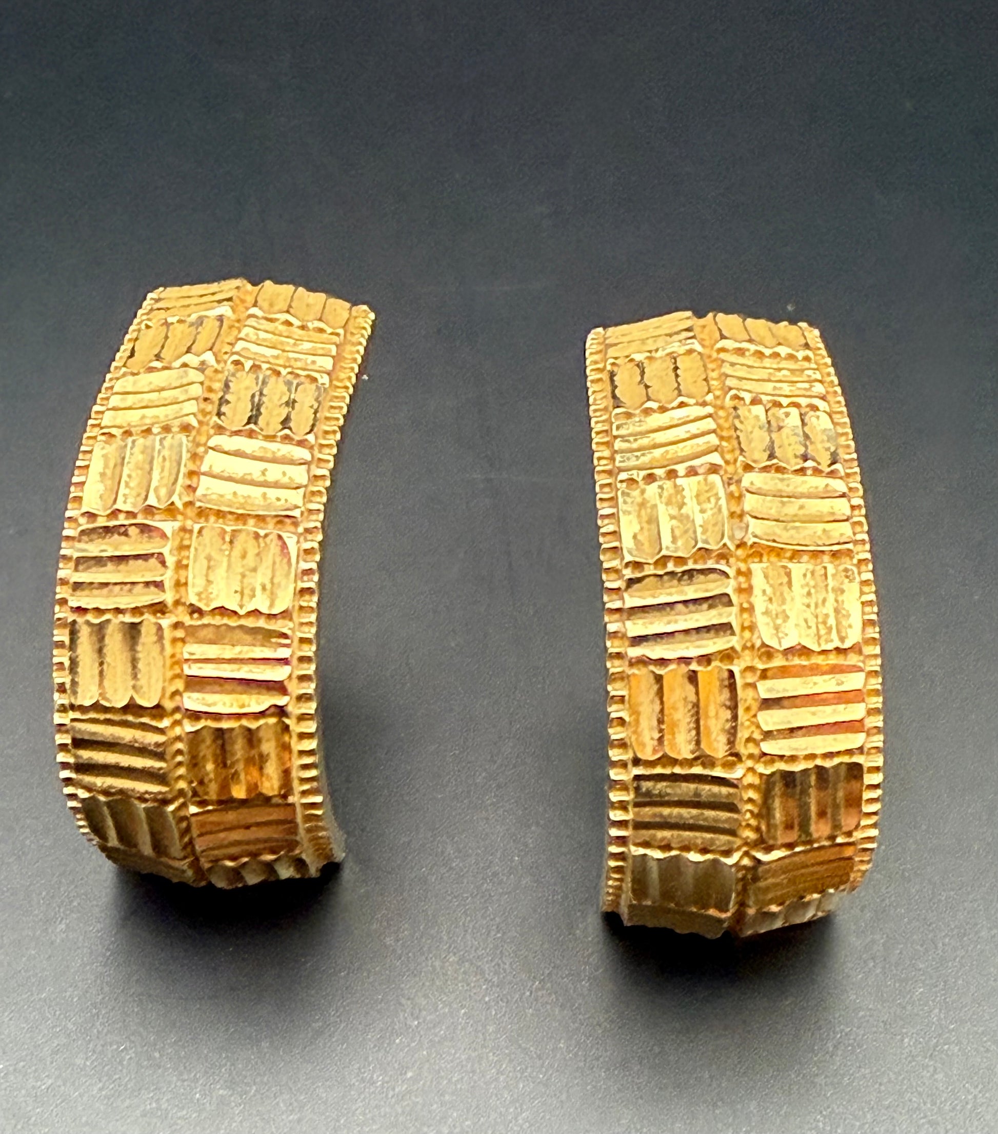 Pair of vintage 14k gold retro half hoop earrings with diamond cut textured design by ZRW, front view