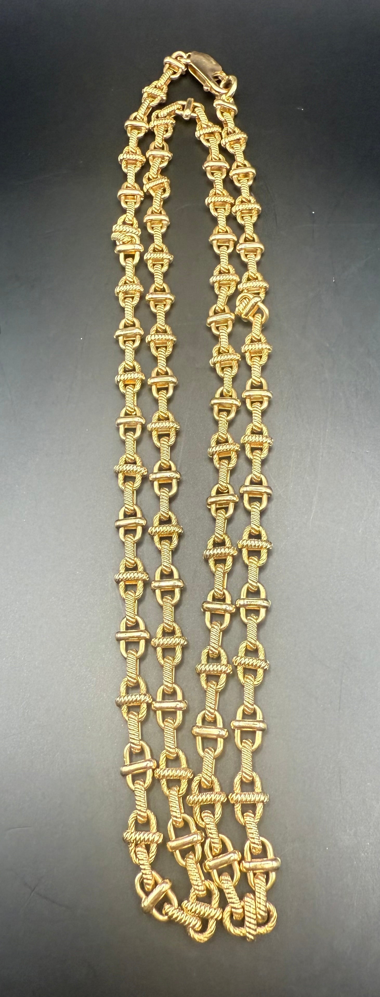Coiled and laid flat view of heavy vintage 14K gold link necklace