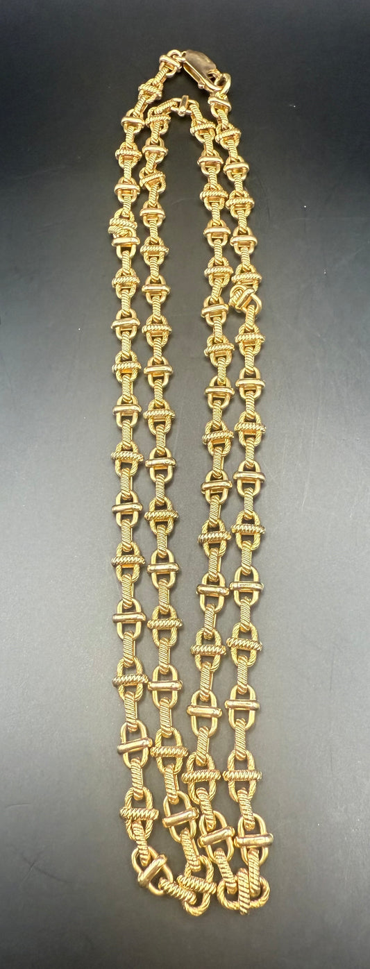 Coiled and laid flat view of heavy vintage 14K gold link necklace