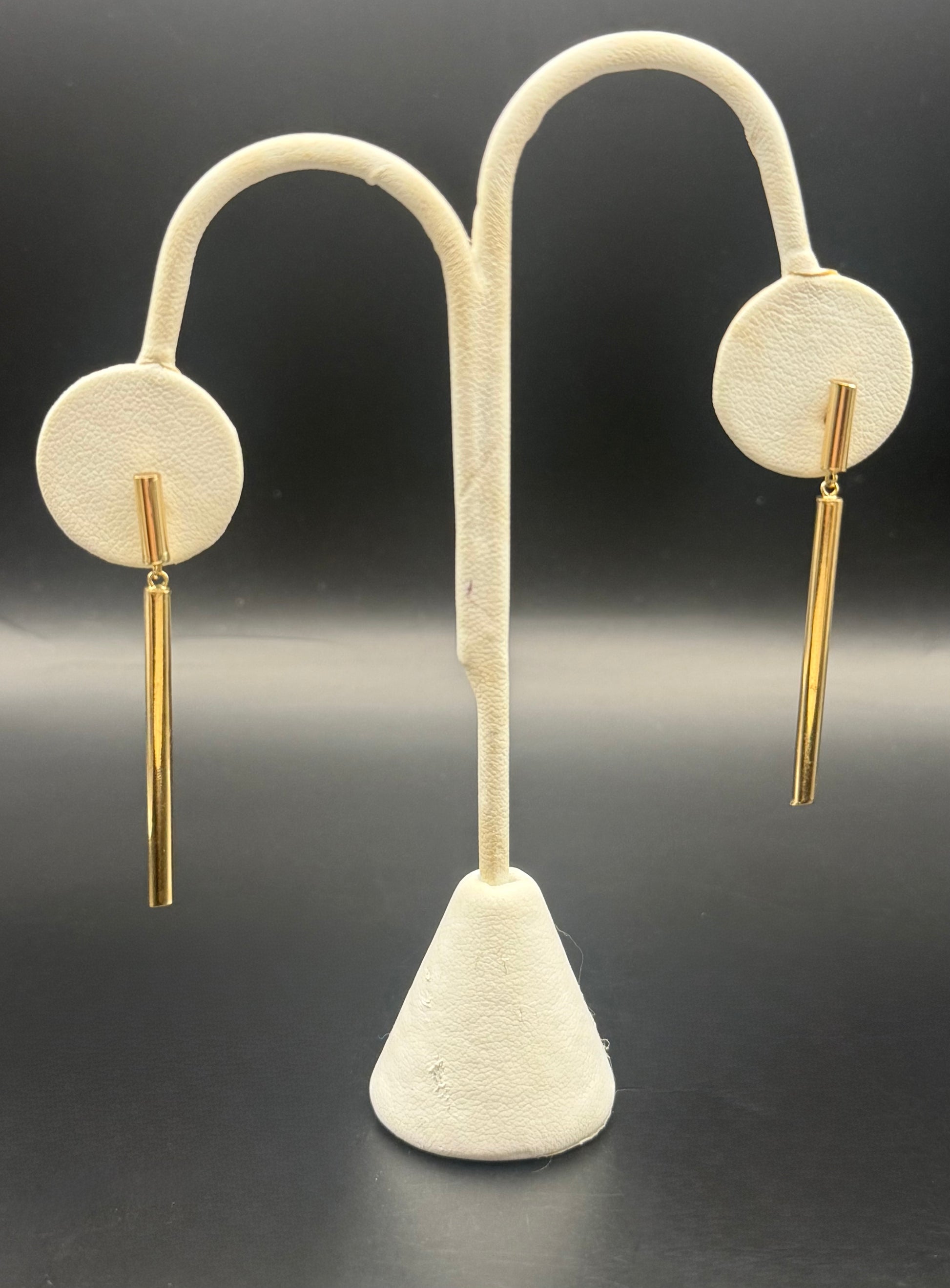 Earrings shown on stand, highlighting 4 cm drop length and elegant silhouette