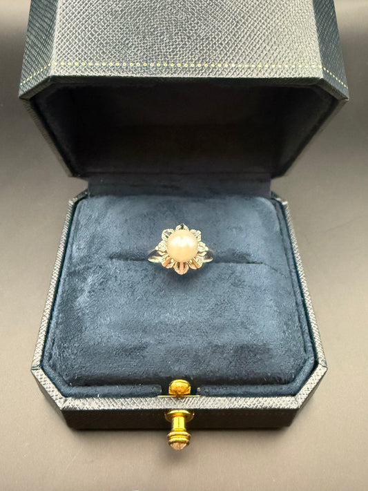 Estate 14K white gold pearl and diamond ring in vintage navy box, classic floral design with round pearl centerpiece.