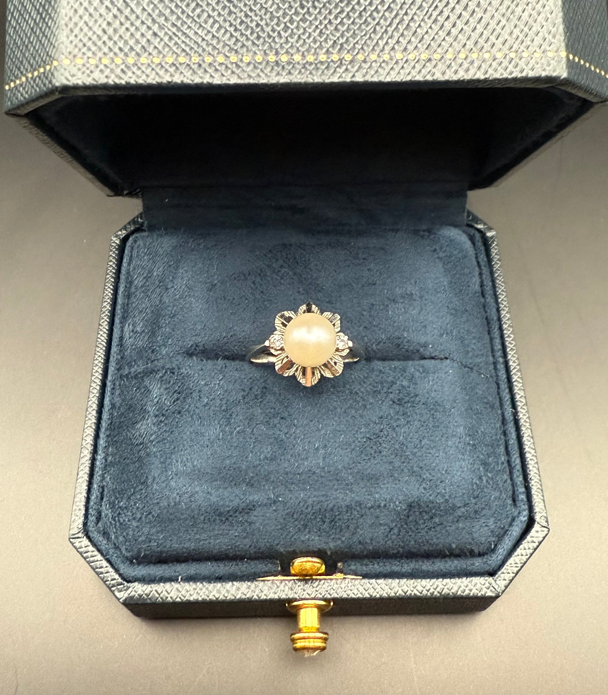 Estate 14K white gold pearl and diamond ring displayed in vintage jewelry box, size 5, timeless floral estate design.