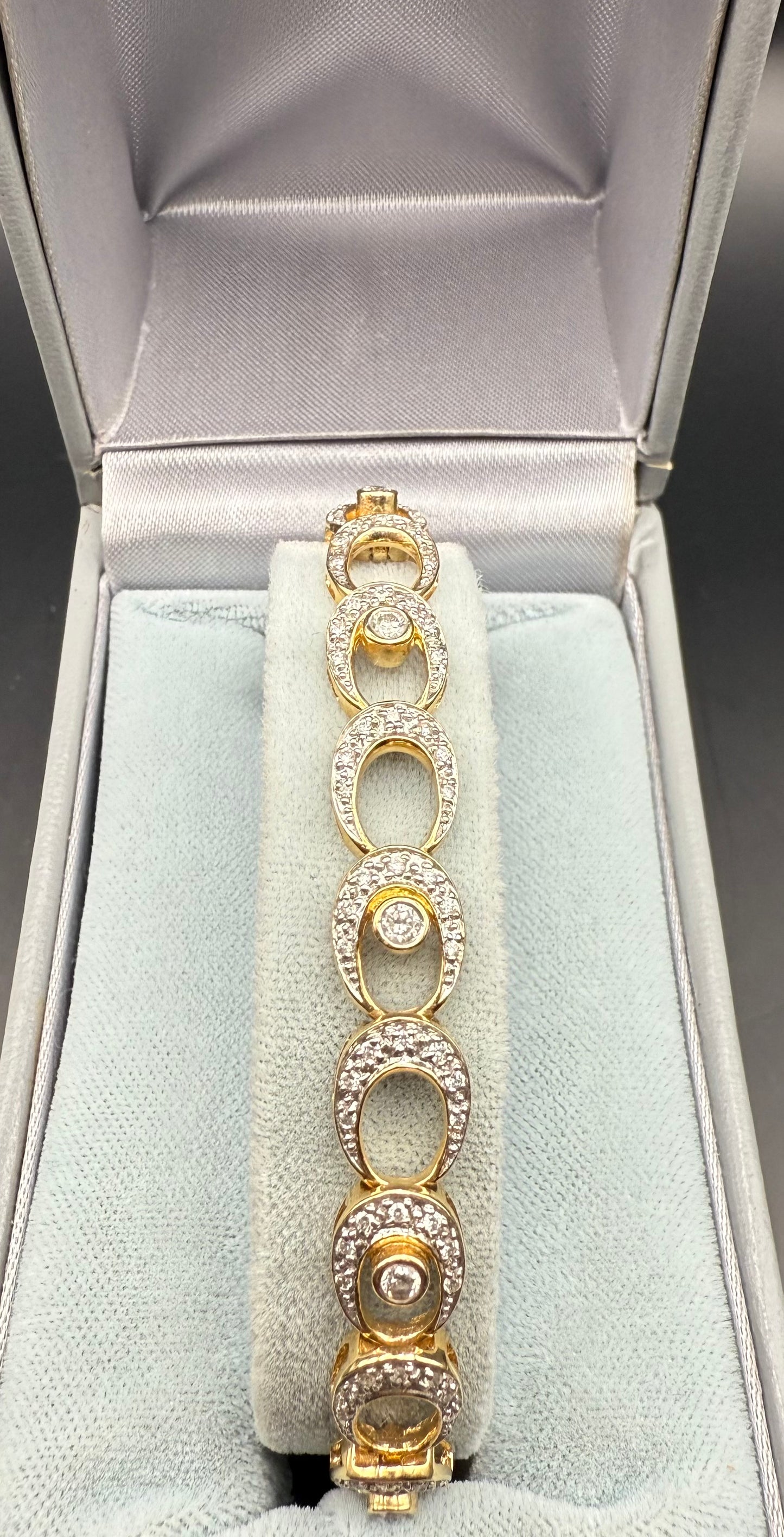Full bracelet view laid in box, vintage 14K gold and diamond tennis bracelet