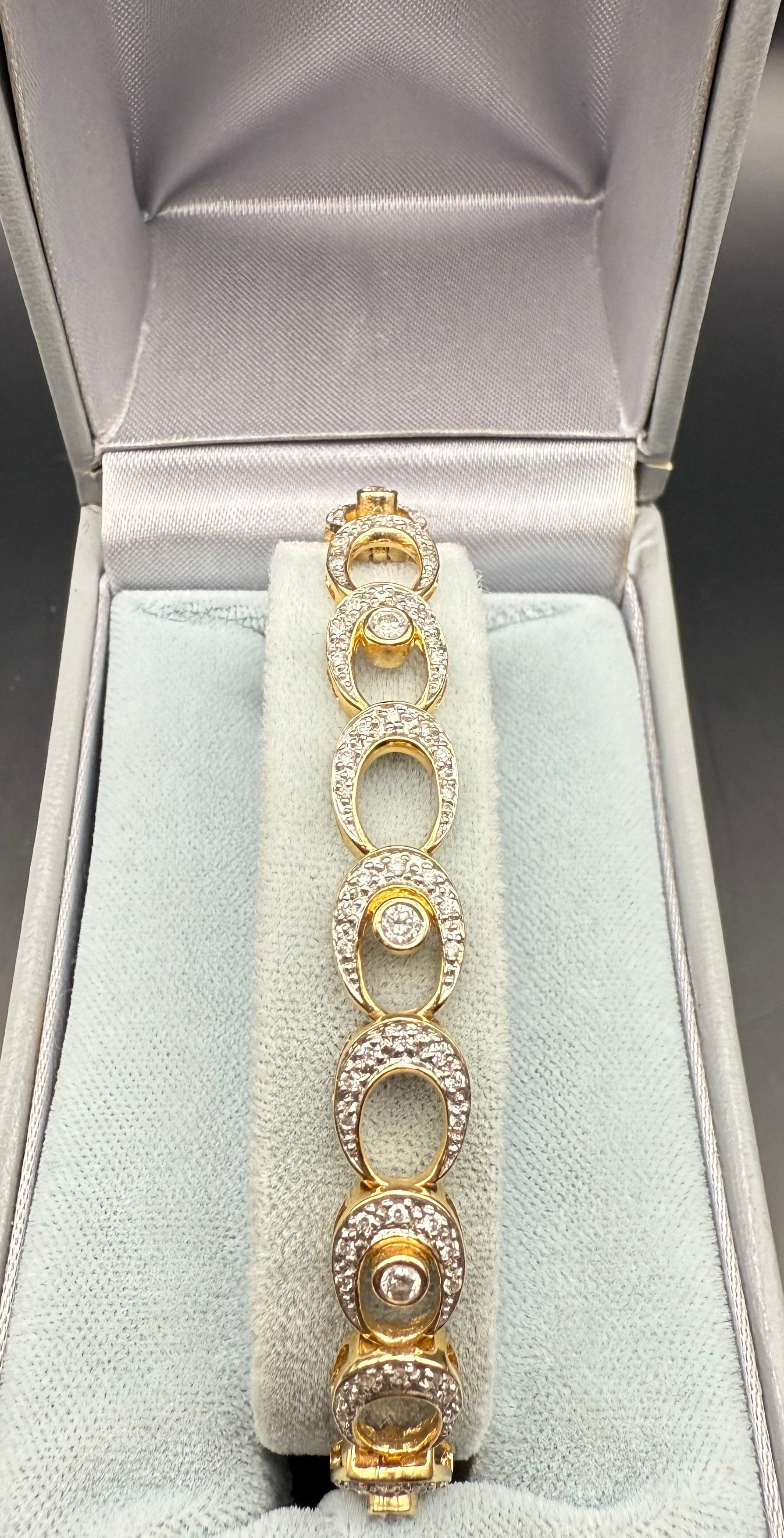 Full bracelet view laid in box, vintage 14K gold and diamond tennis bracelet