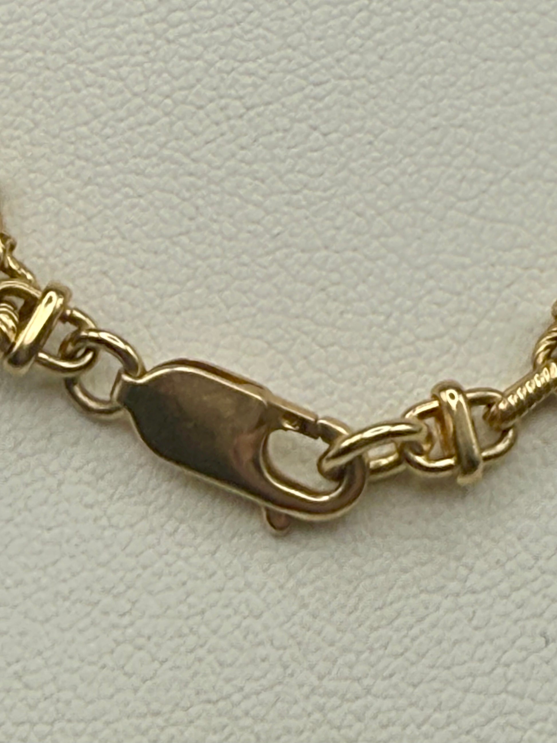 Lobster clasp detail on solid 14K gold chain