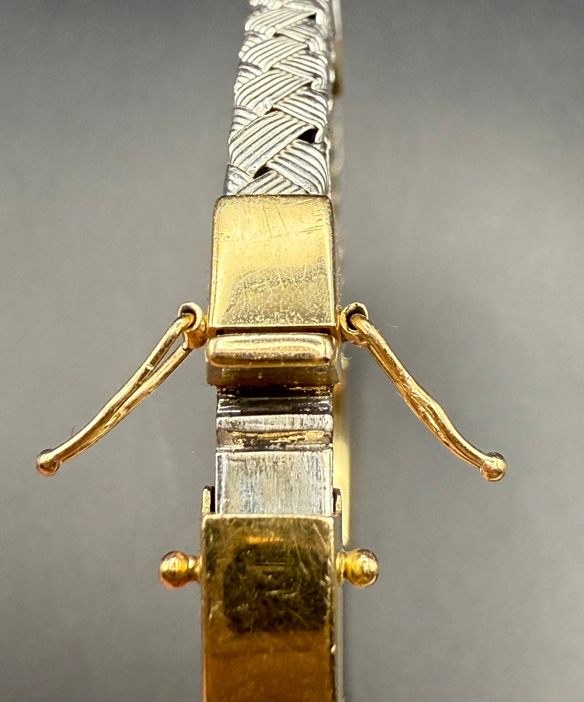 Open view of 14K gold bracelet with secure hinge design