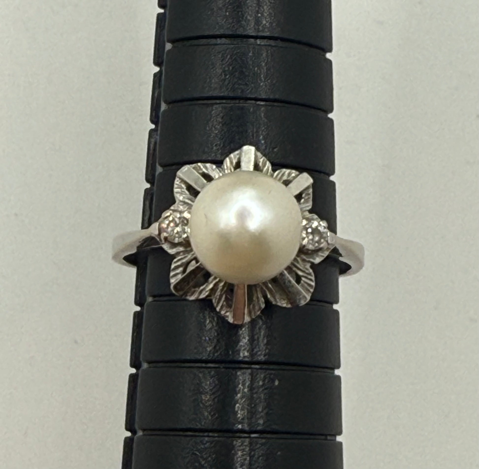 Pearl and diamond vintage ring measured on mandrel, showing size 9.