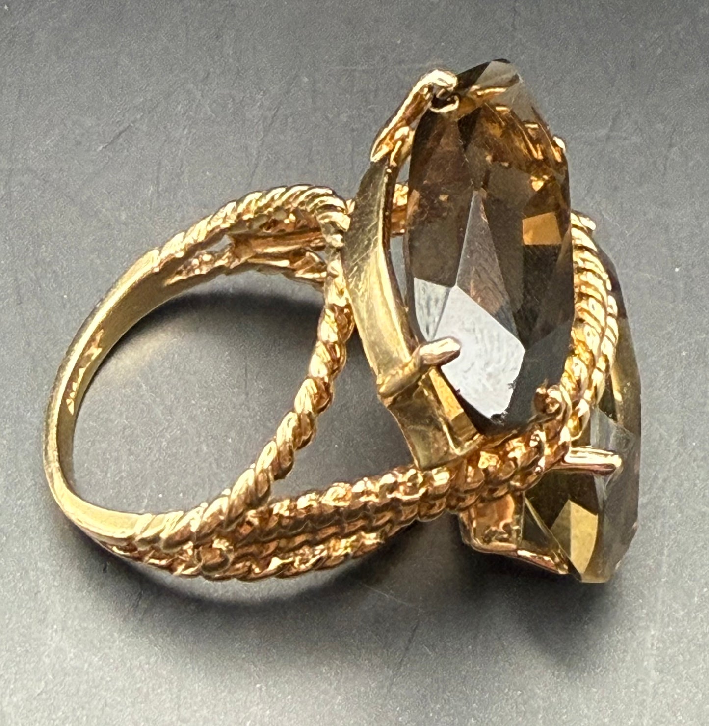Profile of rope-style setting with twin smoky topaz stones