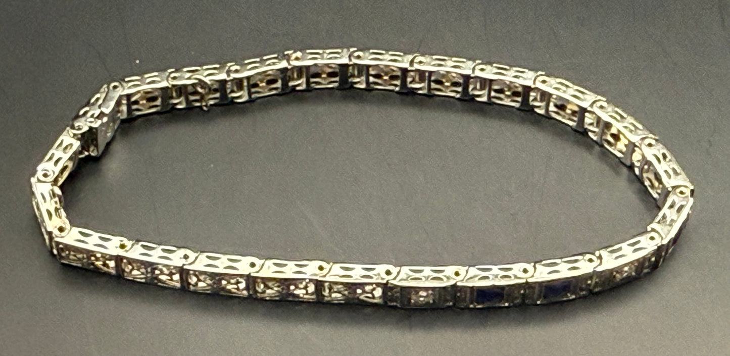 Side profile of bracelet showing engraved filigree pattern and clasp