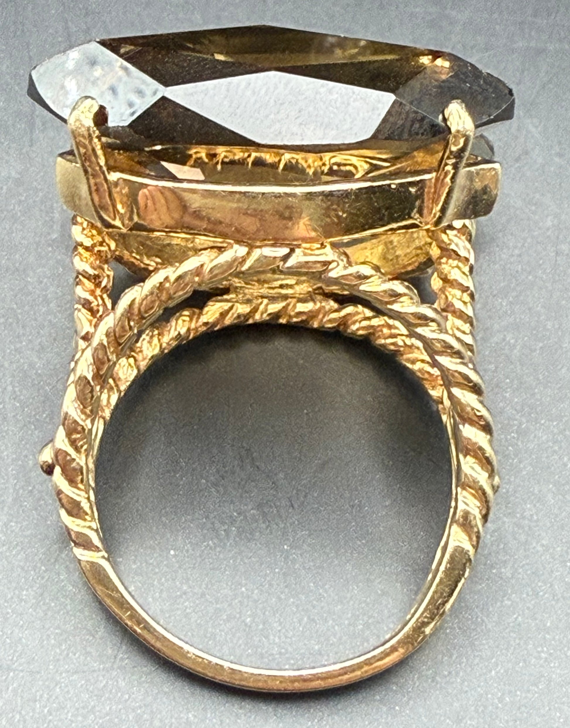 Side view showing marquise-cut smoky topaz and rope gold detail