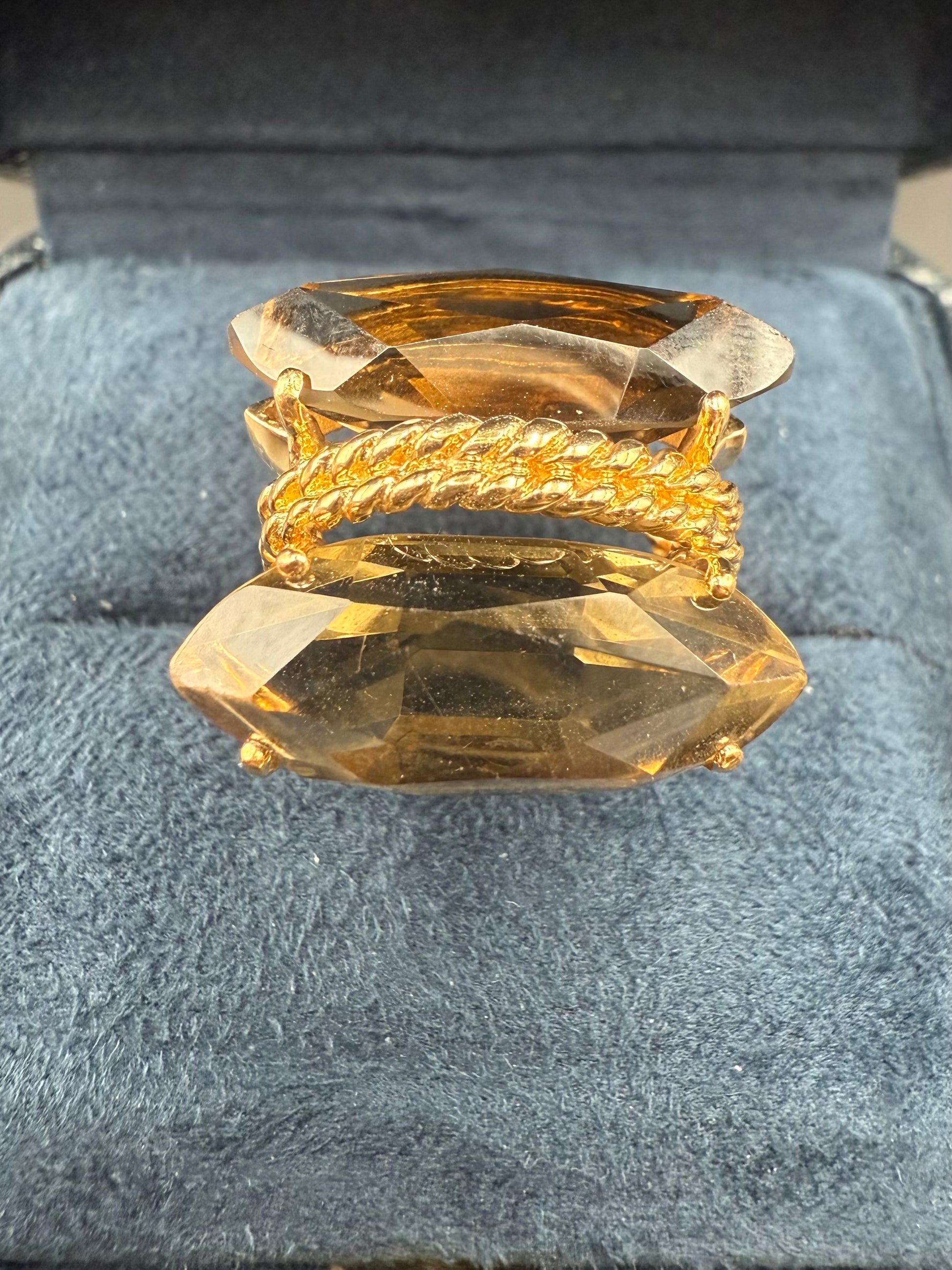 Top-down view of ring showing double gemstone symmetry