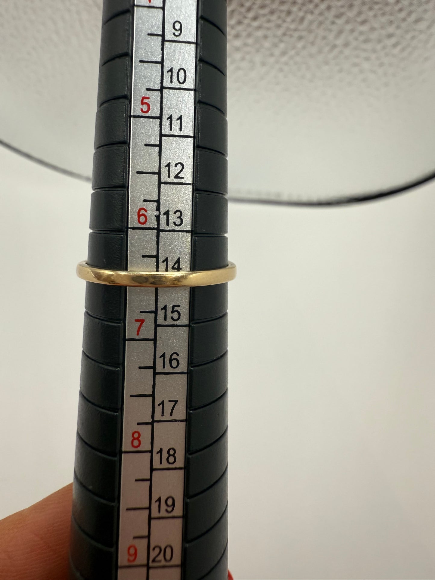 Vintage three-pearl ring on sizing mandrel